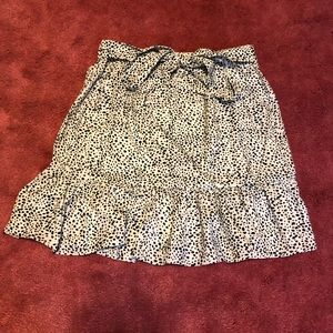 White with black dotted skirt